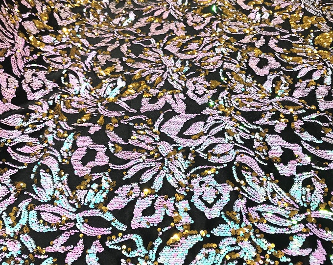 Aqua blue, gold iridescent sequins flip two tone floral design on a black stretch velvet, Sold by the yard.