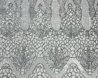 Silver shiny floral damask sequin design on a white 4 way stretch mesh-prom-sold by the yard.