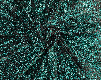 Teal Green economic all over shiny sequins on a 2 way stretch black velvet , sold by the yard.