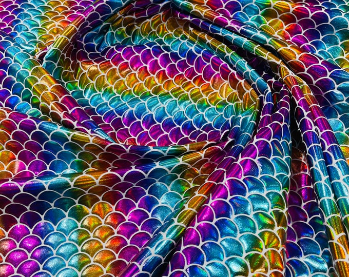 Rainbow iridescent stripe mermaid fish scales on a White stretch spandex-sold by the yard.