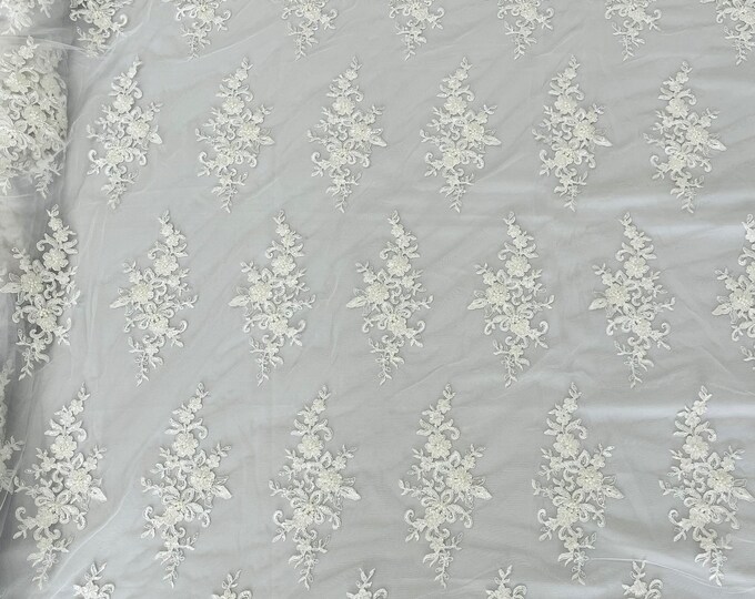 White  flower damask embroider with sequins and heavy beaded on a mesh lace fabric-sold by the yard.