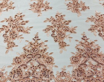Blush pink flower lace corded and embroider with sequins on a mesh-Sold by the yard.