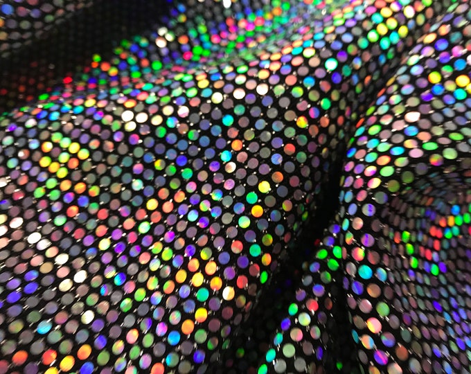 silver iridescent hologram round sequins on a metallic black spandex-sold by the yard-free shipping in the usa.