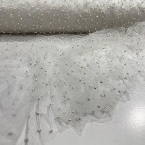 White Scattered Pearls Studded Mesh, 2-Way Stretch, sold by the yard.