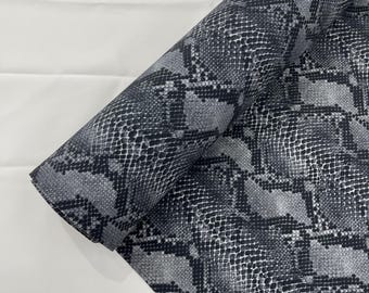 Gray/Black python snake print on a 4 way stretch nylon spandex/58” wide/sold by the yard.