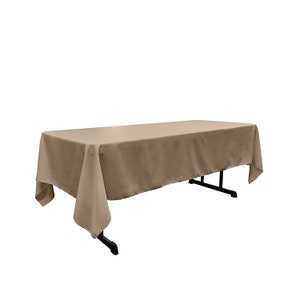 May include: A rectangular tablecloth in a light brown color. The tablecloth is draped over a table and has a smooth, wrinkle-free surface.