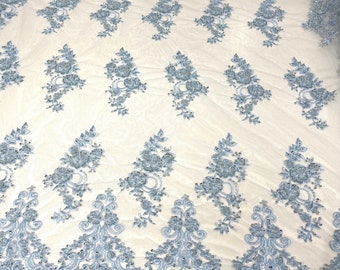 Light Blue elegant hand beaded flower design embroider on a mesh lace-prom-sold by the yard.