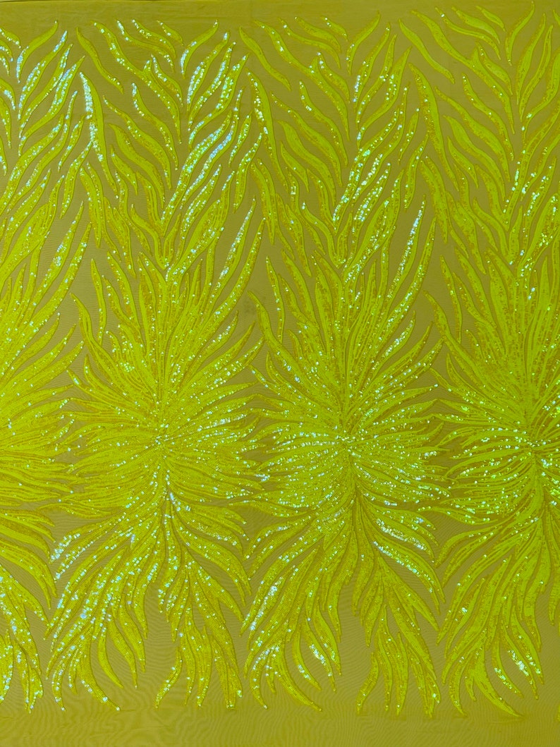 Aqua clear iridescent phoenix feather design with sequins embroider on a White 4 way stretch mesh fabric-sold by the yard. main image 1