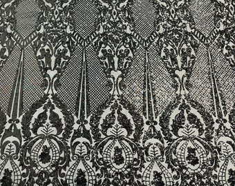 Black shiny sequin damask design on a 4 way stretch mesh-sold by the yard.