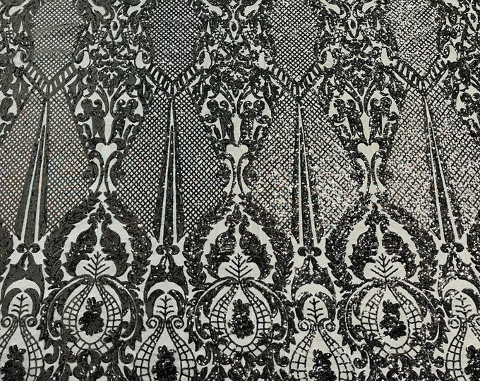 Black shiny sequin damask design on a 4 way stretch mesh-sold by the yard.