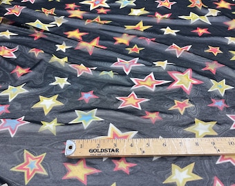 Multi color star design on a black power mesh 4-way stretch 58"-Sold by the yard