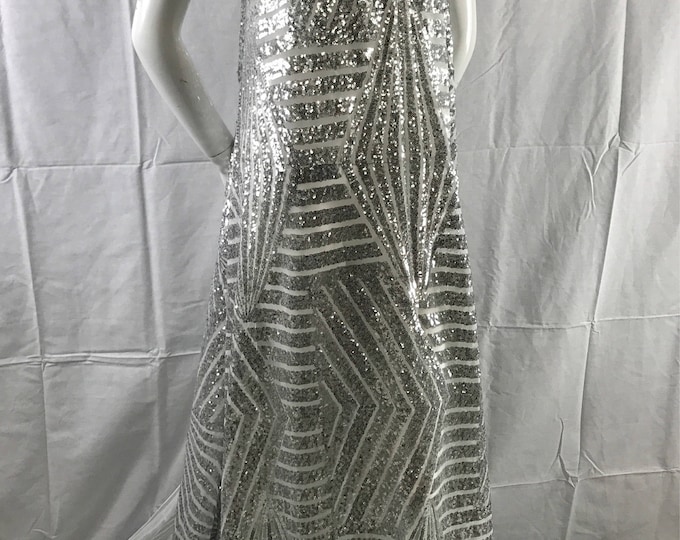 Geometric design embroider with silver sequins on a white mesh-fashion-decorations-nightgown-dresses-sold by the yard.