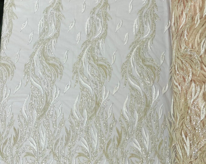 Blush pink feathers embroider and clear heavy beaded on a mesh lace fabric-sold by the yard-