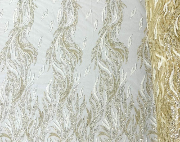 Beige feathers embroider and clear heavy beaded on a mesh lace fabric-sold by the yard-