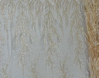 Nude/Clear Fiesta Design Embroider and heavy beading on a mesh lace-sold by the yard.