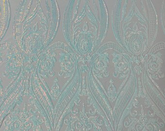 Clear Aqua iridescent empire damask design with sequins embroider on a White 4 way stretch mesh fabric-sold by the yard.