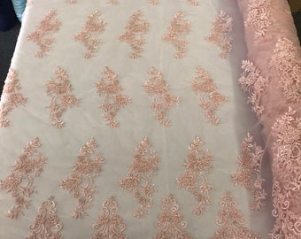 Light pink hand beaded floral design embroidery with shiny sequins on a mesh lace-dresses-apparel-fashion-prom-nightgown-sold by the yard.