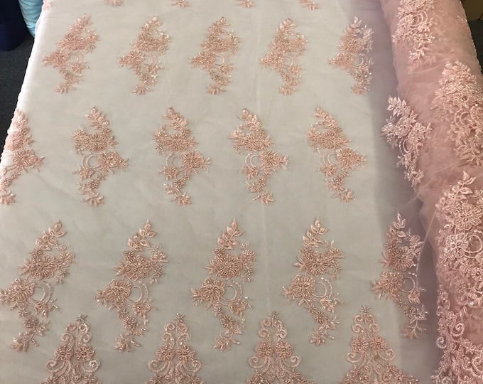 Light pink hand beaded floral design embroidery with shiny sequins on a mesh lace-dresses-apparel-fashion-prom-nightgown-sold by the yard.