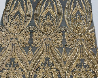 Gold empire damask design with sequins embroider on a Black 4 way stretch mesh fabric-sold by the yard.