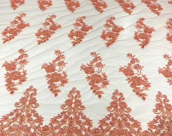 Coral elegant hand beaded flower design embroider on a mesh lace-prom-sold by the yard.