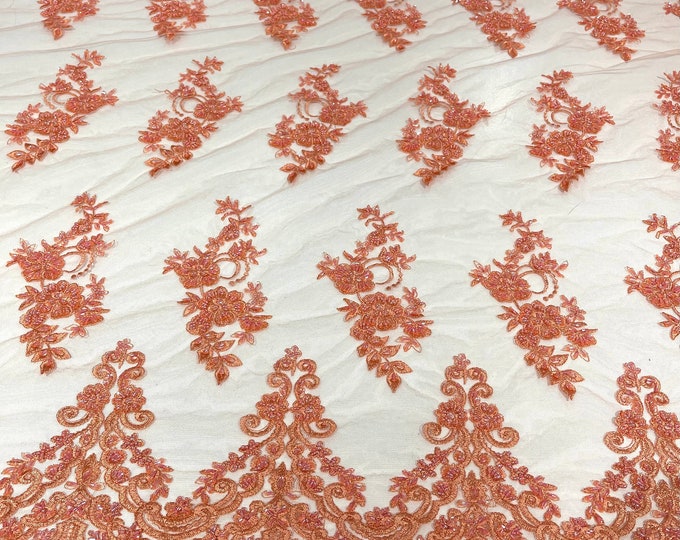 Coral elegant hand beaded flower design embroider on a mesh lace-prom-sold by the yard.