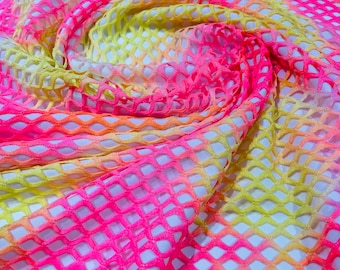 Neon pink/Neon Yellow big fishnet diamond mesh tie dye with silver glitter 4 way stretch 58/60 inches wide. Sold by the yard.
