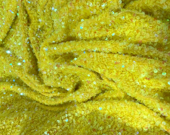 Neon Yellow Iridescent sequins all over a yellow stretch velvet , sold by the yard.