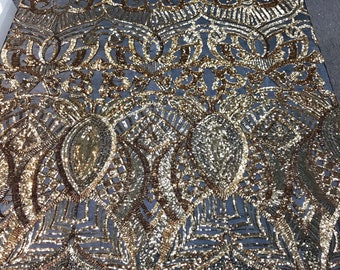 Gold royalty design embroidery sequins on a black 4 way Stretch Mesh -dresses-fashion-apparel-prom-nightgown-sold by the yard.