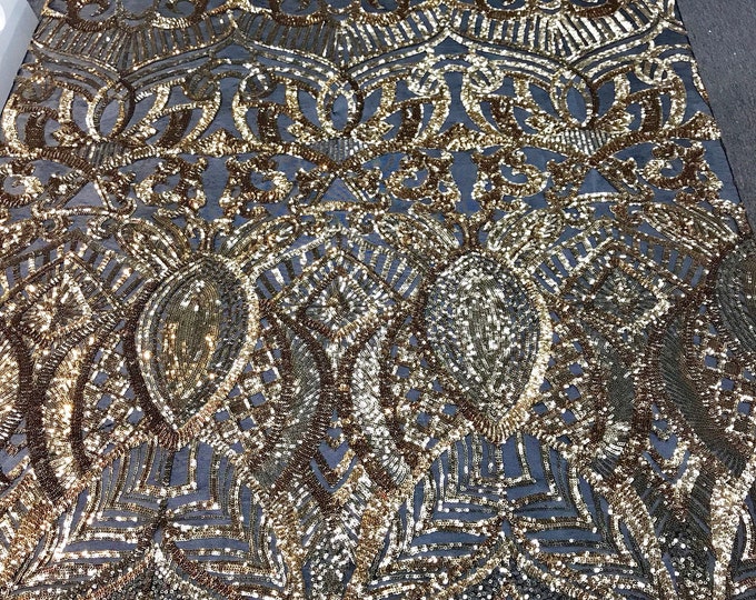 Gold royalty design embroidery sequins on a black 4 way Stretch Mesh -dresses-fashion-apparel-prom-nightgown-sold by the yard.