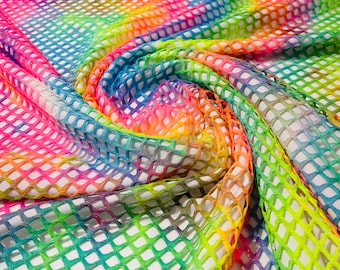 Rainbow big fishnet diamond mesh tie dye with silver glitter 4 way stretch 58/60 inches wide. Sold by the yard.