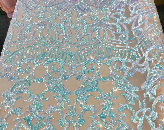 Aqua royalty iridescent sequins on a 4 way stretch nude mesh lace-fashion-prom--sold by the yard.