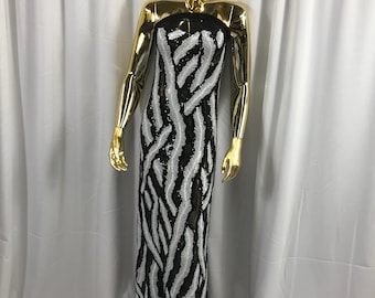Black-white feathers design embroider with shiny-matt sequins on a 4 way stretch power black mesh-dresses-prom-nightgown-sold by the yard.