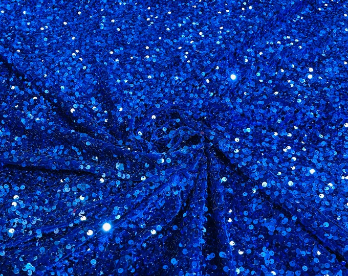 Royal blue 5mm sequins on a stretch velvet 2-way stretch, sold by the yard.