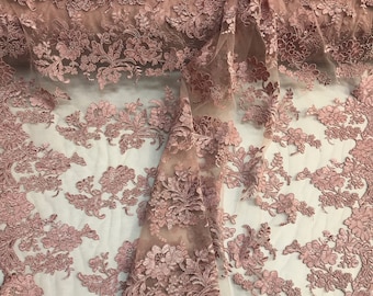 Dusty rose floral design embroider and corded on a mesh lace fabric-fashion-sold by the yard.