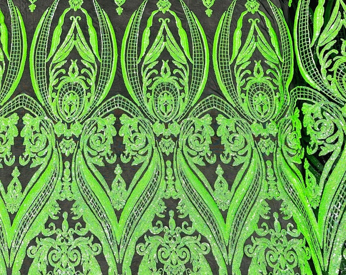 Green iridescent empire damask design with sequins embroider on a black 4 way stretch mesh fabric-sold by the yard.