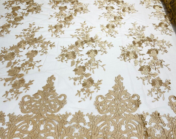 Champagne flowers flat lace embroider on a 2 way stretch mesh sold by the yard.