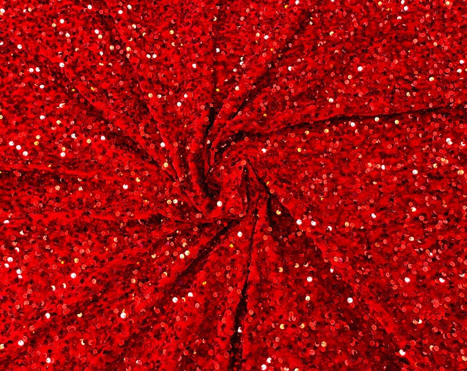 Red economic all over shiny sequins on a 2 way stretch velvet , sold by the yard.