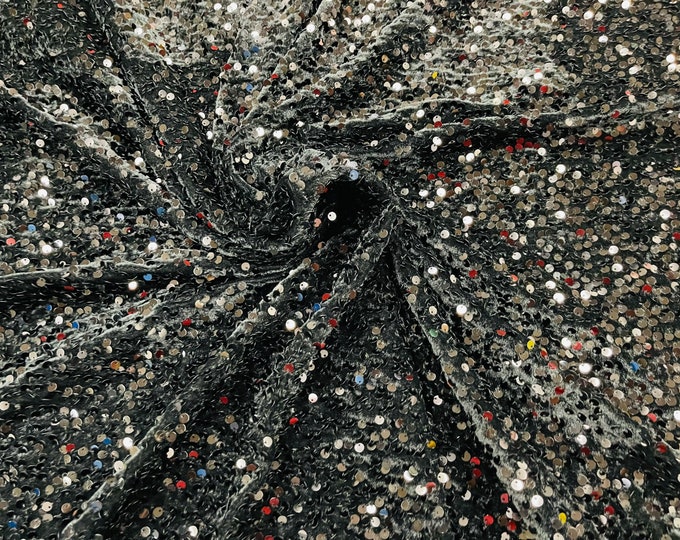 Black economic all over shiny sequins on a 2 way stretch velvet , sold by the yard.