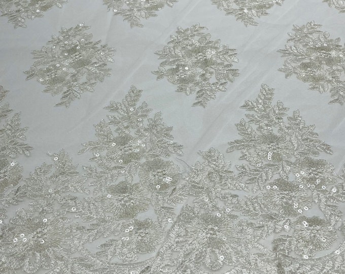 Off white Floral corded embroider with sequins on a mesh lace fabric-sold by the yard.