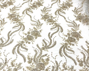 Light Gold  flowers embroider and heavy beaded on a mesh lace fabric-sold by the yard.