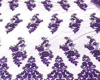 Purple elegant hand beaded flower design embroider on a mesh lace-prom-sold by the yard.