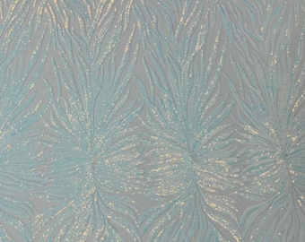 Aqua clear iridescent phoenix feather design with sequins embroider on a White 4 way stretch mesh fabric-sold by the yard.