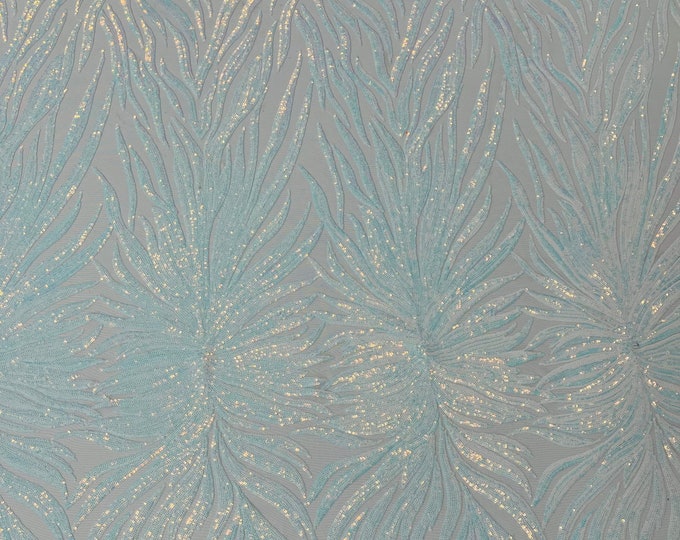 Aqua clear iridescent phoenix feather design with sequins embroider on a White 4 way stretch mesh fabric-sold by the yard.