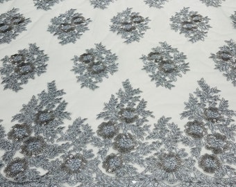 Silver Floral corded embroider with sequins on a mesh lace fabric-sold by the yard.