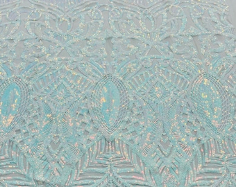 Aqua iridescent royalty sequin design on a 4 way stretch white mesh-prom-nightgown-sold by the yard.