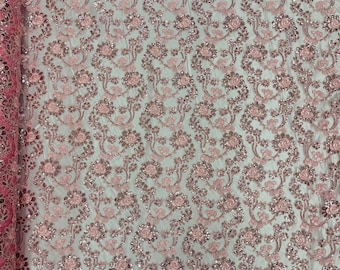 Pink corded flowers embroider with sequins on a mesh lace fabric-prom-sold by the yard.