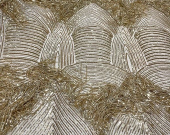 Gold shiny fringe sequins design on a 4 way stretch mesh fabric-prom-sold by the yard.