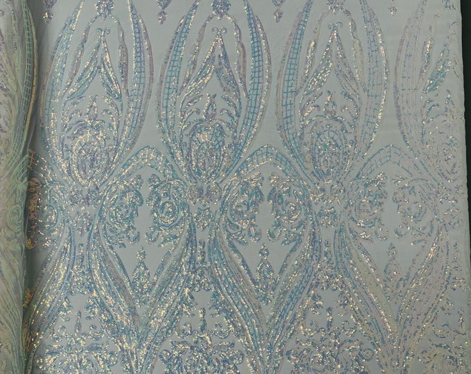 Aqua iridescent empire damask design with clear sequins embroider on a White 4 way stretch mesh fabric-sold by the yard.