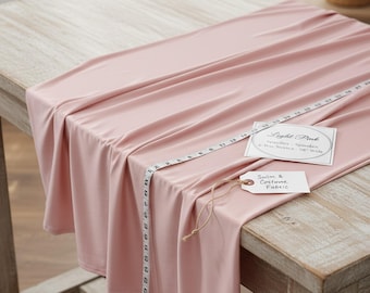 Lichtroze nylon-spandexstof, 147 cm breed met 4-way stretch voor badkleding en kostuums.