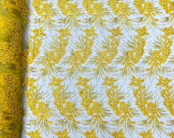 Yellow feather design lace with metallic cord and embroider with sequins on a mesh-Sold by the yard.